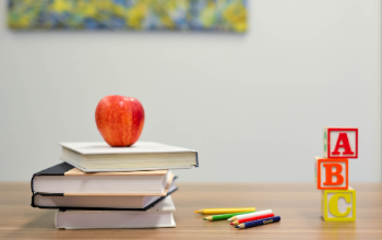 books with an apple and ABC blocks