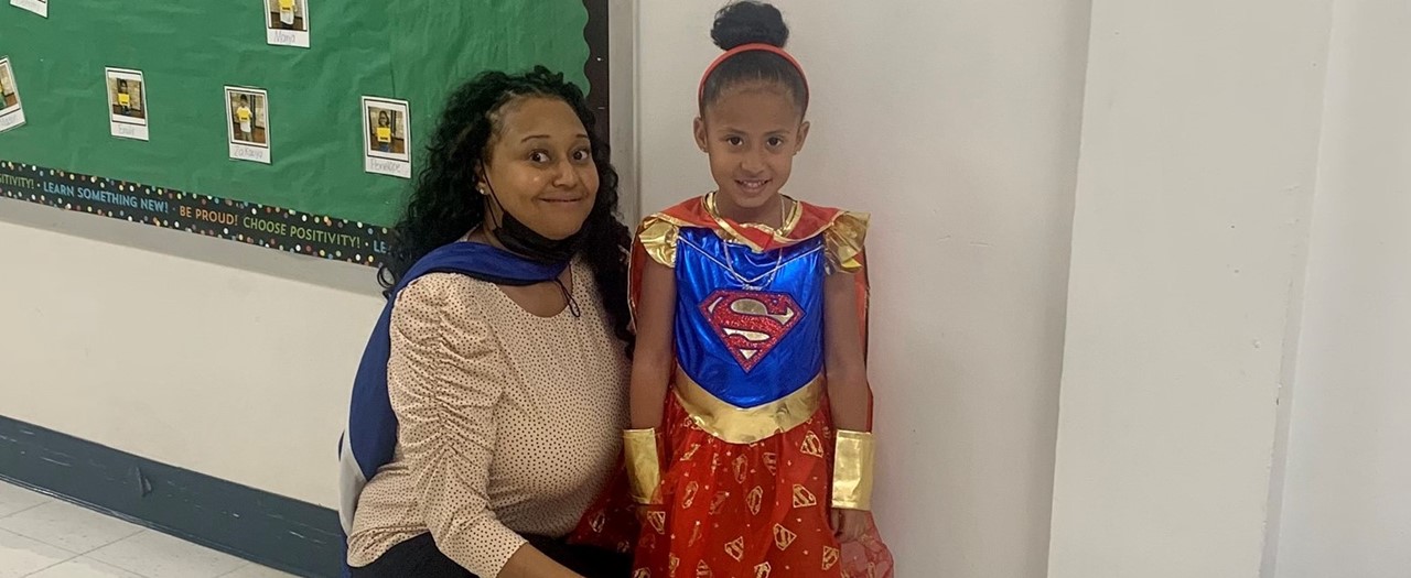 Principal and Student Wearing Capes