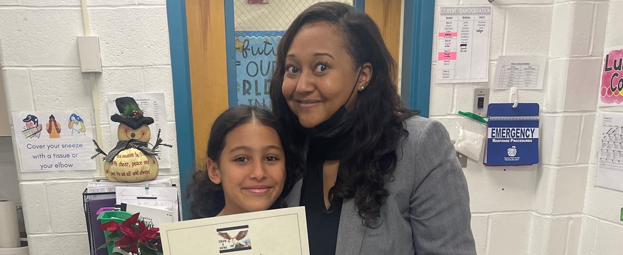 Student and Principal with Certificate