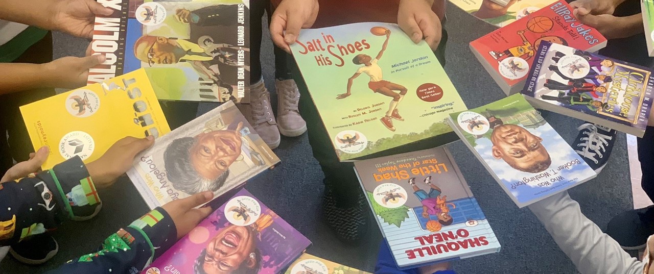 Students holding books